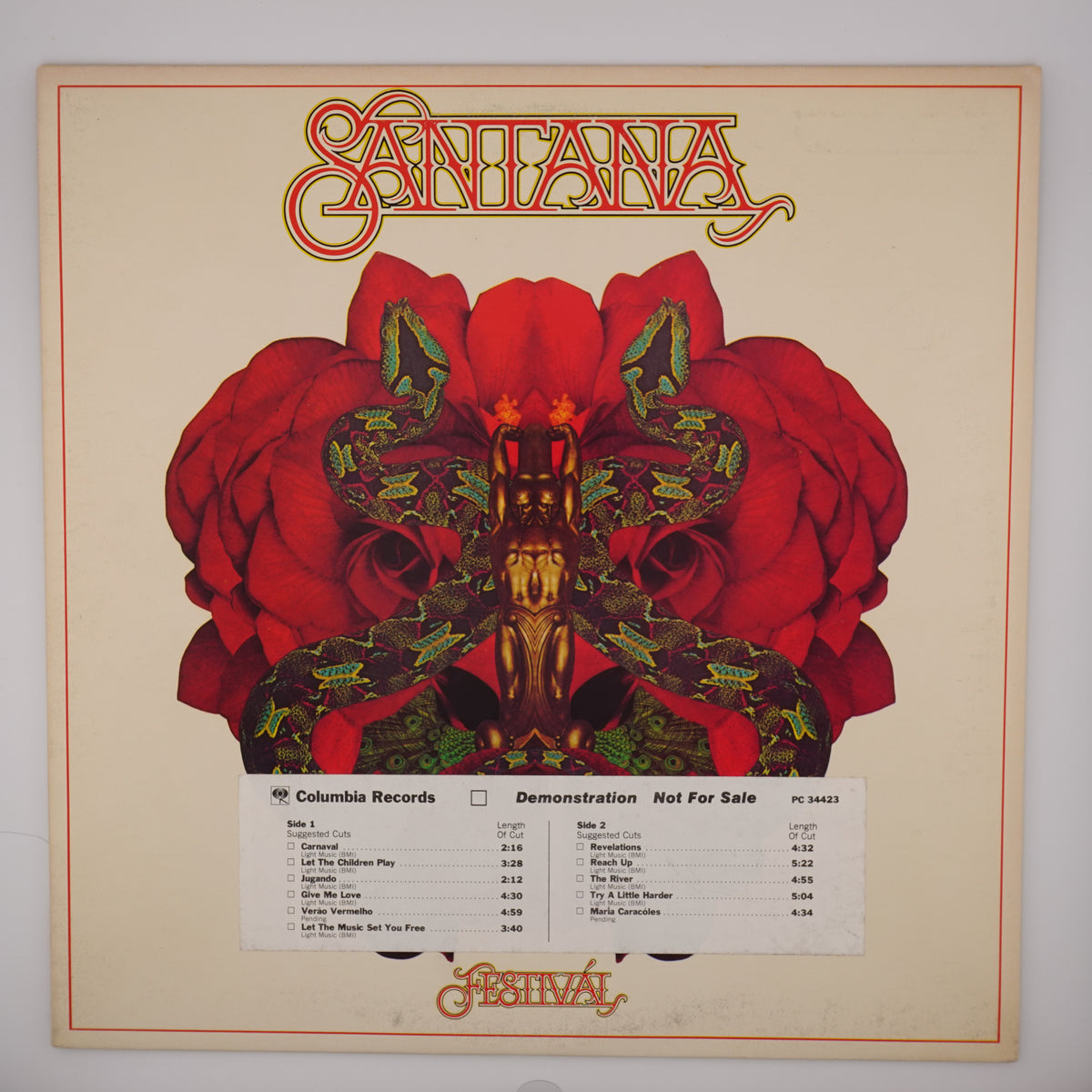The front cover of the Santana 'Festival' album on Columbia Records, featuring a large red rose design with a central gold-toned figure and the band's name in stylized red lettering at the top.